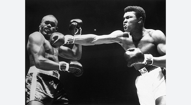 Muhammad Ali, then Cassius Clay, lands a punch during a 1963 bout against Doug Jones.