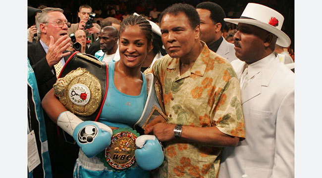 Laila Ali and Muhammad Ali pose for a photo after Laila won the Super Middleweight title in June 2005.