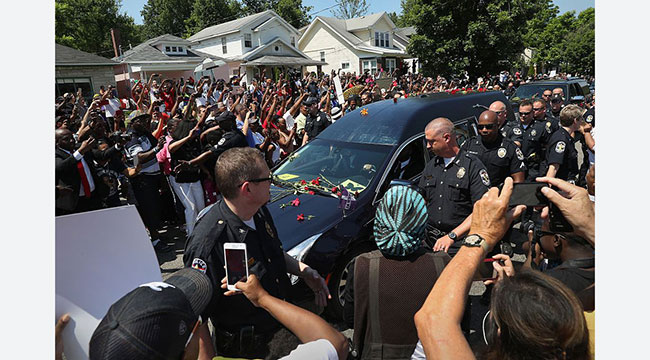 Fans line the path of Muhammad Ali’s funeral procession in 2016 near his childhood home in Louisville, Kentucky.